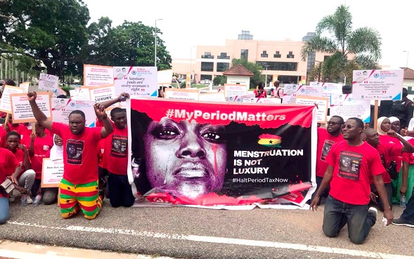 Some members of the civil society organisations with placards kneeling down to dramatise the event Some members of the civil society organisations with placards kneeling down to dramatise the event