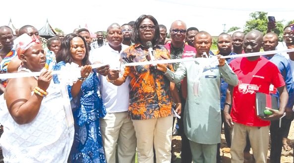 Justina Owusu-Banahene (3rd from right), Bono Regional Minister, being assisted by Adama Sulemana (2nd from right), Tain MP, and Dr Lucy Acheampong (2nd from left), Tain District Chief Executive, to inaugurate the Bepoayase KG classroom block Justina Owusu-Banahene (3rd from right), Bono Regional Minister, being assisted by Adama Sulemana (2nd from right), Tain MP, and Dr Lucy Acheampong (2nd from left), Tain District Chief Executive, to inaugurate the Bepoayase KG classroom block