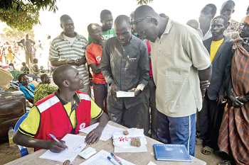 UNHCR officials registering refugees at a reception centre