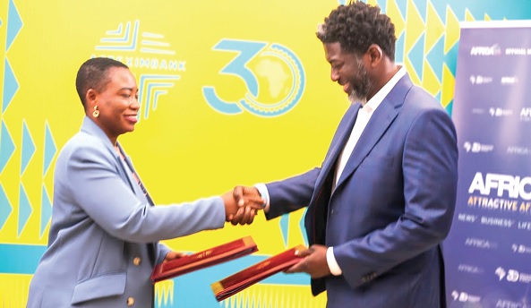 Kevin Okyere (right), Chief Executive Officer, Springfield, exchanging the loan documents with Oluranti Doherty, Director, Export Development of Afreximbank Kevin Okyere (right), Chief Executive Officer, Springfield, exchanging the loan documents with Oluranti Doherty, Director, Export Development of Afreximbank