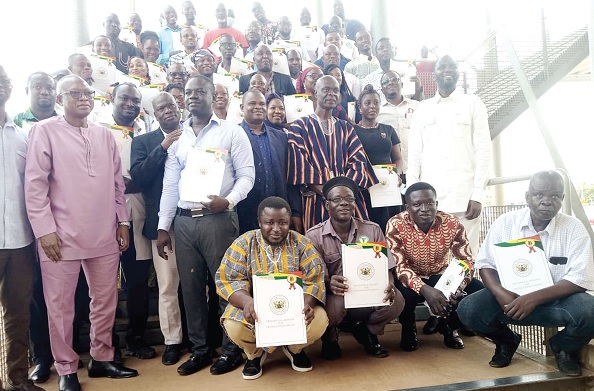 Shani Alhassan Shaibu (arrowed), Northern Regional Minister, with some of the staff displaying their awards Shani Alhassan Shaibu (arrowed), Northern Regional Minister, with some of the staff displaying their awards