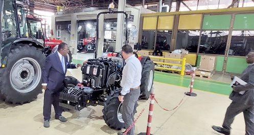 Dr Owusu Afriyie Akoto (right) observing the make of one of the tractors Dr Owusu Afriyie Akoto (right) observing the make of one of the tractors