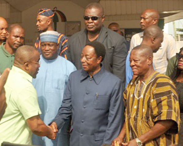 Dr Kwabena Duffuor  (2nd from right) being welcomed to the Greater Accra Regional Office of the NDC by Nii Ashie Moore, Regional Chairman of the party