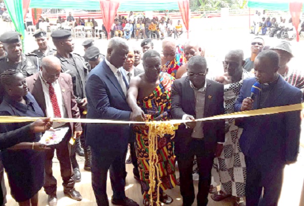 Nana Nkansah Ababio (arrowed), Edwenase Wiosohene, being supported by Justice Anin Yeboah (left) and Richmond Agyenim Boateng (middle), MCE for Kwadaso, to cut the tape to inaugurate the courthouse Nana Nkansah Ababio (arrowed), Edwenase Wiosohene, being supported by Justice Anin Yeboah (left) and Richmond Agyenim Boateng (middle), MCE for Kwadaso, to cut the tape to inaugurate the courthouse