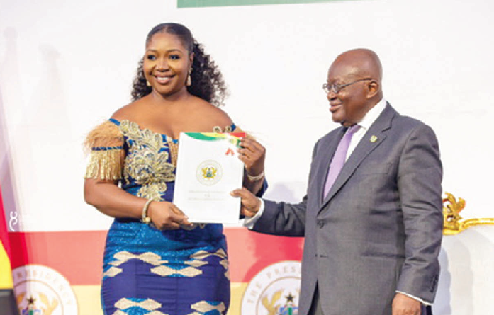 Dedo Kofi (left), receiving a citation from President Nana Addo Dankwa Akufo-Addo at the recent national awards. Advertising firms urged to support country in times of crisis