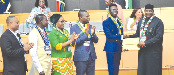 • President Adama Barrow (right), President of The Gambia, presenting the Overall Best Candidate award to Alex Opoku Manu, winner, International Excellence Awards, WASSCE for School Candidates, 2022, while Wendy E. Addy-Lamptey (2nd from left), HNO of WAEC; Dr Eric Nkansah (3rd from right), Director-General of the GES, and others applaud • President Adama Barrow (right), President of The Gambia, presenting the Overall Best Candidate award to Alex Opoku Manu, winner, International Excellence Awards, WASSCE for School Candidates, 2022, while Wendy E. Addy-Lamptey (2nd from left), HNO of WAEC; Dr Eric Nkansah (3rd from right), Director-General of the GES, and others applaud