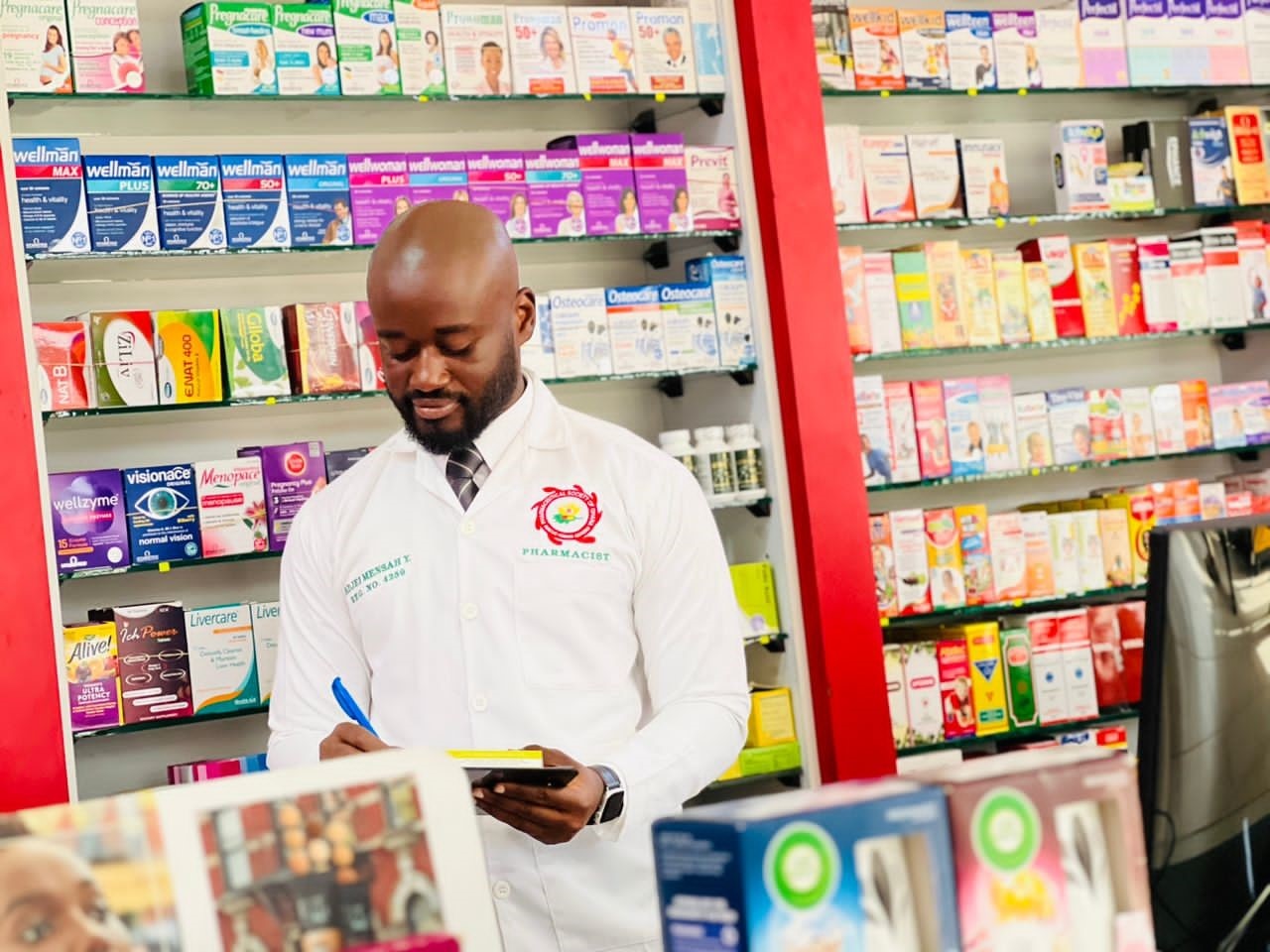 Dr Kwadjo Yeboah Adjei-Mensah, a pharmacist in Accra going through his normal duty of dispensing medicines.