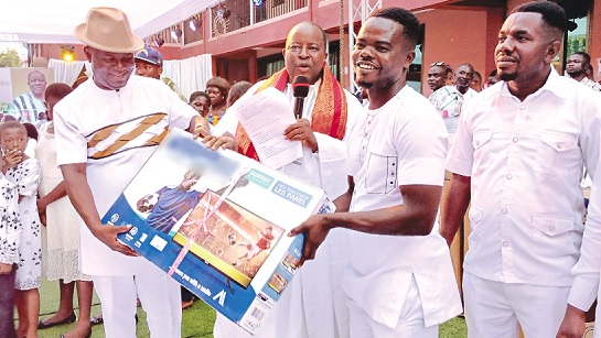 • Chief Superintendent Anthony Arthur (left) of the Police Headquarters in Accra presenting one of the awards to Seth Ankomah Adjei, one of the awardees. With them is Francis Essel-Okyeahene (middle) • Chief Superintendent Anthony Arthur (left) of the Police Headquarters in Accra presenting one of the awards to Seth Ankomah Adjei, one of the awardees. With them is Francis Essel-Okyeahene (middle)