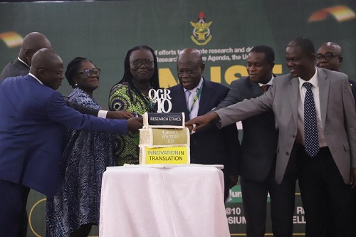 Ambassador Nana Effah-Apenteng(middle), Council Chairman, KNUST, being assisted by Professor Mrs Rita Akosua Dickson (3rd left), VC, KNUST, and some other dignitaries, to cut the 10th anniversary cake of the Office of Grant and Research(OGR), during the launch of the KNUST Research Week in Kumasi. Ambassador Nana Effah-Apenteng(middle), Council Chairman, KNUST, being assisted by Professor Mrs Rita Akosua Dickson (3rd left), VC, KNUST, and some other dignitaries, to cut the 10th anniversary cake of the Office of Grant and Research(OGR), during the launch of the KNUST Research Week in Kumasi.