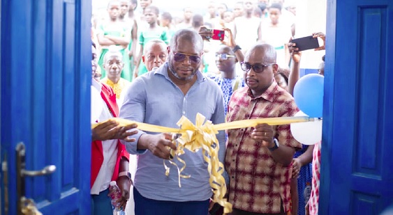 • Edward Mensah (right), Corporate Social Responsibility Coordinator of Yinson Ghana, being assisted by John Agyare, Executive Committee Chairman of the Ahanta West Municipal Assembly, to open the facility • Edward Mensah (right), Corporate Social Responsibility Coordinator of Yinson Ghana, being assisted by John Agyare, Executive Committee Chairman of the Ahanta West Municipal Assembly, to open the facility