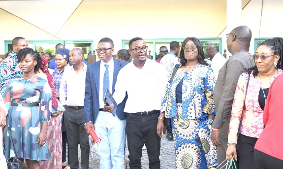 Emmanuel Teye Kenney (middle), CEO of Flokefama, interacting with some participants after the conference. Picture: EBOW HANSON