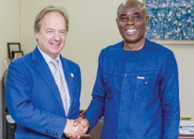 Prof. Abednego Feehi Okoe (right), Vice-Chancellor of the UPSA, in a handshake with Lord Swire, Deputy Chairman of the CWEIC, during his visit to the university