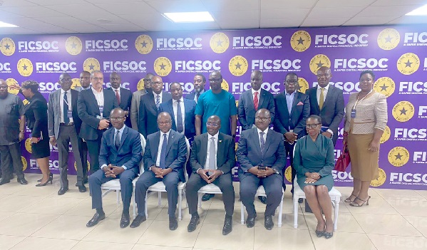 • Dr Ernest Addison (seated 2nd from right), Dr Mahamudu Bawumia (seated 3rd from right) with some CEOs of the banks after the commissioning BoG commissions centre to fight cyber attacks