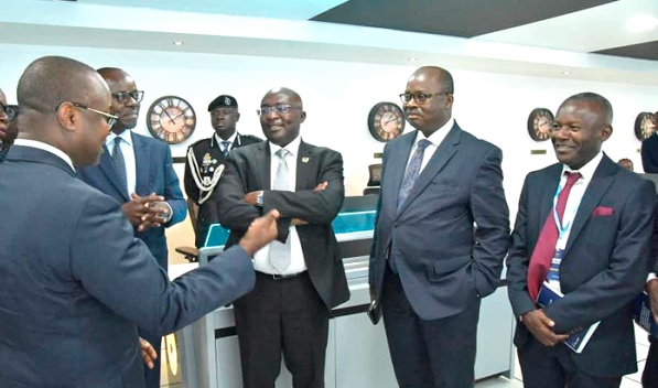 Dr Maxwell Opoku-Afari (left), First Deputy Governor, BoG, explaining a point to Dr Mahamudu Bawumia (middle), Vice-President, Dr Ernest Addison (2nd from right), Governor, BoG, and Emmanuel Sekyere-Asiedu, (right) CEO, Virtual Info-Sec Africa, and others at the commissioning of FICSOC Dr Maxwell Opoku-Afari (left), First Deputy Governor, BoG, explaining a point to Dr Mahamudu Bawumia (middle), Vice-President, Dr Ernest Addison (2nd from right), Governor, BoG, and Emmanuel Sekyere-Asiedu, (right) CEO, Virtual Info-Sec Africa, and others at the commissioning of FICSOC