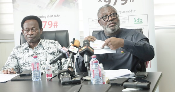 Dr Paul Opoku-Mensah (right), Executive Director, National Cathedral of Ghana, explaining a document to participants during the media briefing. With him is Apostle Prof. Kwadwo Opoku Onyinah, Chairman of the National Cathedral Board of Trustees. Picture: EDNA SALVO-KOTEY