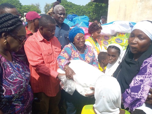 Frema Osei-Opare (arrowed) Chief of Staff, distributing the relief items to the flood victims Frema Osei-Opare (arrowed) Chief of Staff, distributing the relief items to the flood victims