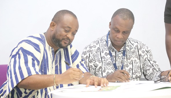 Pius Enam Hadzide (left), Chief Executive Officer, National Youth Authority, and Nii Doodoo Dodoo, Country Director, British Council, signing the MoU in Accra. Picture: SAMUEL TEI ADANO Pius Enam Hadzide (left), Chief Executive Officer, National Youth Authority, and Nii Doodoo Dodoo, Country Director, British Council, signing the MoU in Accra. Picture: SAMUEL TEI ADANO