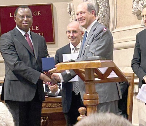 Akanjolenur Joseph Whittal (left), CHRAJ Commissioner, receiving a medal from Riccardo Guariglia (right), Secretary-General of the Ministry of Foreign Affairs of Italy Akanjolenur Joseph Whittal (left), CHRAJ Commissioner, receiving a medal from Riccardo Guariglia (right), Secretary-General of the Ministry of Foreign Affairs of Italy