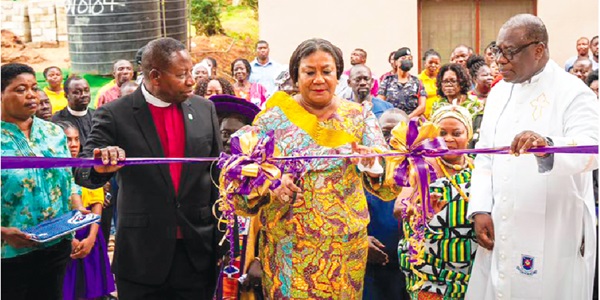Rebecca Akufo-Addo, First Lady, cutting the tape to open the hostel. With her are Rt Rev. Prof. Joseph Obiri Yeboah Mante (right), Moderator of the General Assembly of the Presbyterian Church of Ghana, and Rev. Ebenezer Acheampong Asiedu (left), Akuapem Presbytery chairperson Rebecca Akufo-Addo, First Lady, cutting the tape to open the hostel. With her are Rt Rev. Prof. Joseph Obiri Yeboah Mante (right), Moderator of the General Assembly of the Presbyterian Church of Ghana, and Rev. Ebenezer Acheampong Asiedu (left), Akuapem Presbytery chairperson
