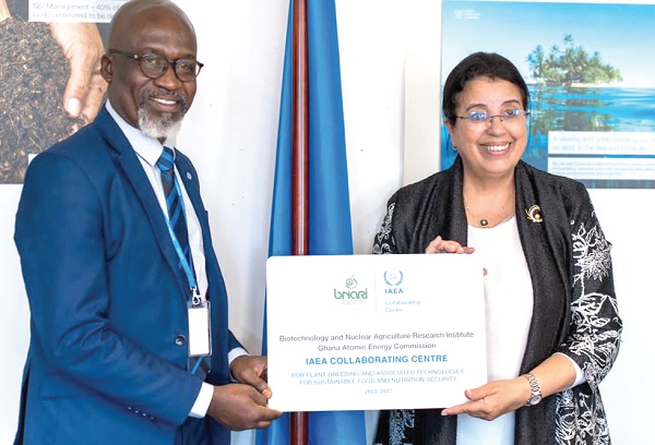 Prof. Samuel Boakye Dampare (left), Director-General of GAEC, receiving the certificate designating BNARI as an IAEA Collaborating Centre from Najat Mokhtar, IAEA Deputy Director-General and Head of the Department, IAEA Prof. Samuel Boakye Dampare (left), Director-General of GAEC, receiving the certificate designating BNARI as an IAEA Collaborating Centre from Najat Mokhtar, IAEA Deputy Director-General and Head of the Department, IAEA