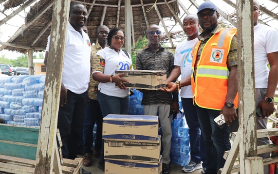 Dr Stanislas Adiaba (2nd from right), supported by some executive of the association to present the items to Thomas Zonyra (middle). With them is Seji Saji Amedonu (right), Deputy Director-General of NADMO. Picture: DELLA RUSSEL OCLOO Dr Stanislas Adiaba (2nd from right), supported by some executive of the association to present the items to Thomas Zonyra (middle). With them is Seji Saji Amedonu (right), Deputy Director-General of NADMO. Picture: DELLA RUSSEL OCLOO
