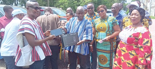Stephen Yakubu (3rd from right), Upper East Regional Minister, presenting one of the tablets to Daniel Kwame Gariba (left), Builsa South District Chief Executive Stephen Yakubu (3rd from right), Upper East Regional Minister, presenting one of the tablets to Daniel Kwame Gariba (left), Builsa South District Chief Executive