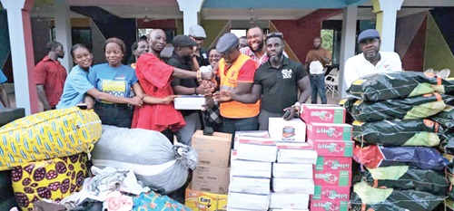 Eugene Armah Okyne (right), UCC Brethren Executive Secretary, and team making the presentation to Rockson-Nelson Dafeamekpor, MP South-Dayi 