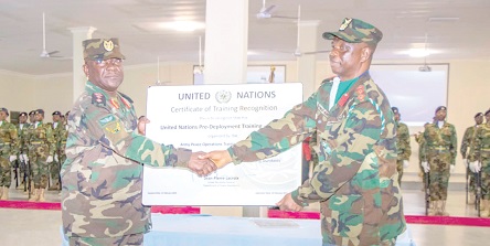 Major General Thomas Oppong-Peprah (left), the Chief of the Army Staff, presenting the certification to Colonel Clement Dingane (right), Commander of APOTS Major General Thomas Oppong-Peprah (left), the Chief of the Army Staff, presenting the certification to Colonel Clement Dingane (right), Commander of APOTS