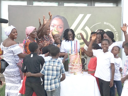 Rev. Dr Davina Markwei (arrowed) cutting her birthday cake with some beneficiaries Rev. Davina Markwei celebrates 60th birthday with widows, single mothers