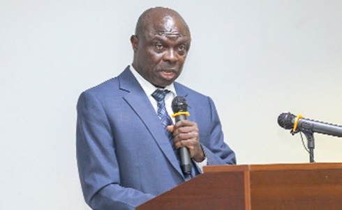 Henry Antwi (left), Mining and Metals Consultant, delivering the keynote addresss at the youth conference