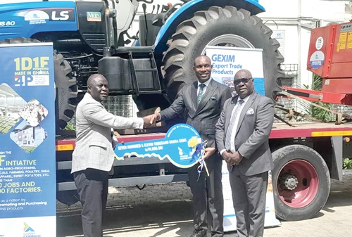 Bright Evans Darko (2nd from right), Head of SME Banking of GEXIM, presenting a dummy key to Yaw Frimpong Addo, Deputy Minister of Food and Agriculture in charge of Crops, while Emmanuel Essilfie-Conduah, Head, Corporate Affairs of GEXIM Bank, looks on Bright Evans Darko (2nd from right), Head of SME Banking of GEXIM, presenting a dummy key to Yaw Frimpong Addo, Deputy Minister of Food and Agriculture in charge of Crops, while Emmanuel Essilfie-Conduah, Head, Corporate Affairs of GEXIM Bank, looks on