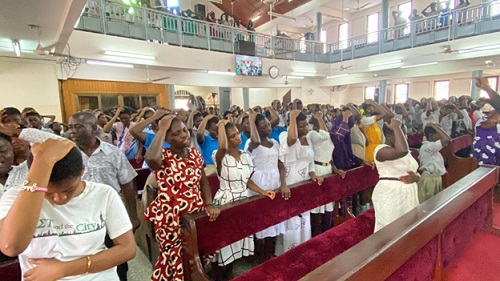 A section of the attendees praying. A section of the attendees praying.