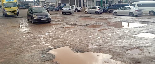 The poor state of the road near the Mandela Park intersection after a rainfall The poor state of the road near the Mandela Park intersection after a rainfall