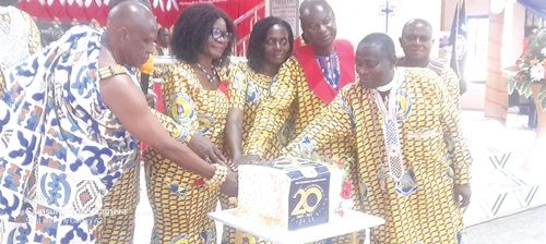 Rt Rev. Alfred Appiah Andam (right), Bishop of Wenchi Diocese, being assisted by Nana Asa Akompanin (left), Chief of Keobo, near Techiman, to cut the 20th anniversary cake Rt Rev. Alfred Appiah Andam (right), Bishop of Wenchi Diocese, being assisted by Nana Asa Akompanin (left), Chief of Keobo, near Techiman, to cut the 20th anniversary cake