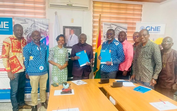 Ehunabobrim Prah Agyensaim (4th from left) and Kwabena Bempong (5th from right), displaying the signed MoU, while other GhIE Council members look on Ehunabobrim Prah Agyensaim (4th from left) and Kwabena Bempong (5th from right), displaying the signed MoU, while other GhIE Council members look on