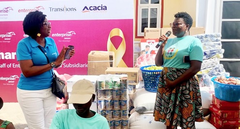 Phyllis Woode-Nartey (left), Head of Group Communications and Synergies, Enterprise, after presenting the items to Vida Ampiah, Ward Matron Phyllis Woode-Nartey (left), Head of Group Communications and Synergies, Enterprise, after presenting the items to Vida Ampiah, Ward Matron