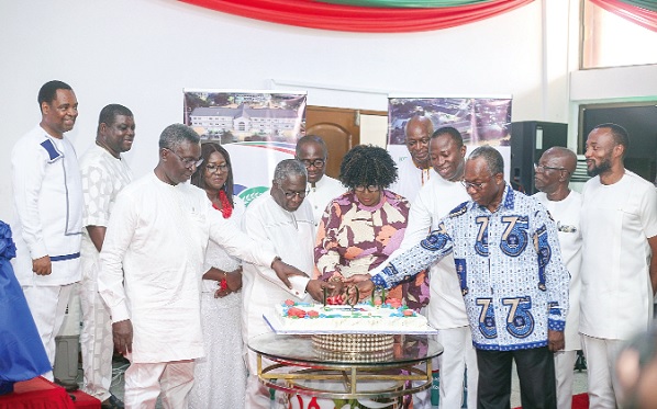 Tina Mensah (middle), a deputy Minister of Health, being assisted by Dr Opoku Ware Ampomah (3rd from right), CEO of Korle Bu, and other heads of department to cut the cake Tina Mensah (middle), a deputy Minister of Health, being assisted by Dr Opoku Ware Ampomah (3rd from right), CEO of Korle Bu, and other heads of department to cut the cake