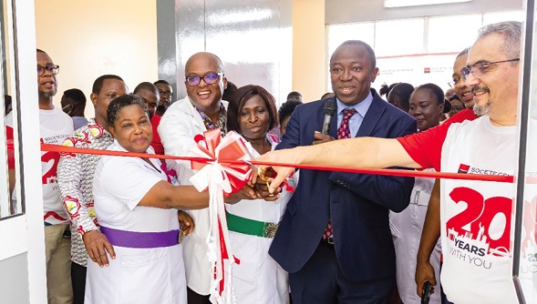 Dr Opoku Ware Ampomah (2nd from right), the CEO of the KBTH, being assisted by Hakim Ouzzani (right), the MD for SG Ghana, and other dignitaries to cut the tape Dr Opoku Ware Ampomah (2nd from right), the CEO of the KBTH, being assisted by Hakim Ouzzani (right), the MD for SG Ghana, and other dignitaries to cut the tape