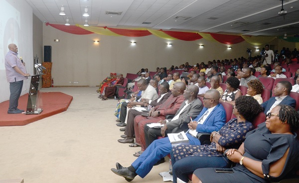  Henry Quartey (left), Greater Accra Regional Minister, addressing the participants 