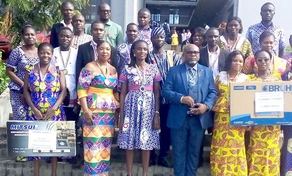 The awardees with Rev. Peter Attah Bilson (middle), the Yilo Krobo Municipal Director of Education The awardees with Rev. Peter Attah Bilson (middle), the Yilo Krobo Municipal Director of Education