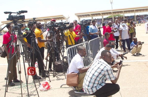 Some media personnel providing coverage at an event Some media personnel providing coverage at an event