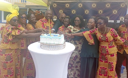 Oheneyere Gifty Anti  (2nd from right) helping the leadership of the association and other dignitaries to cut the anniversary cake