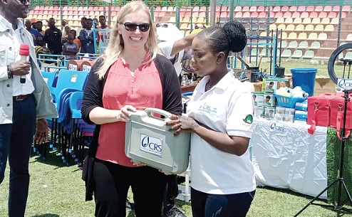 Shannon Senefeld (left), Senior Vice-President for Overseas Operations at CRS, presenting a start-up kit to a beneficiary Shannon Senefeld (left), Senior Vice-President for Overseas Operations at CRS, presenting a start-up kit to a beneficiary