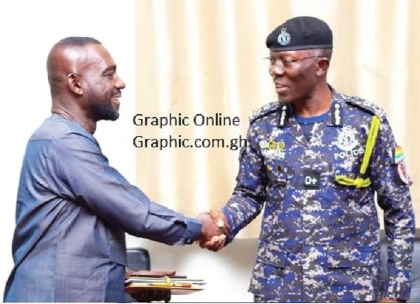 IGP Dampare (right) in a handshake with COP George Alex Mensah IGP Dampare (right) in a handshake with COP George Alex Mensah
