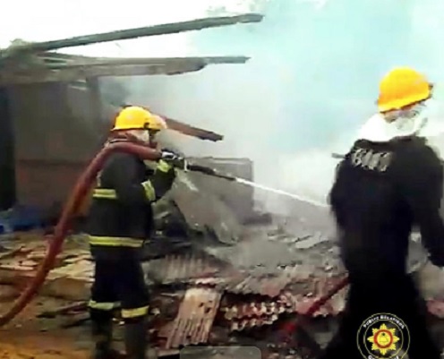 Fire fighters dousing the fire at the CMB area Fire fighters dousing the fire at the CMB area