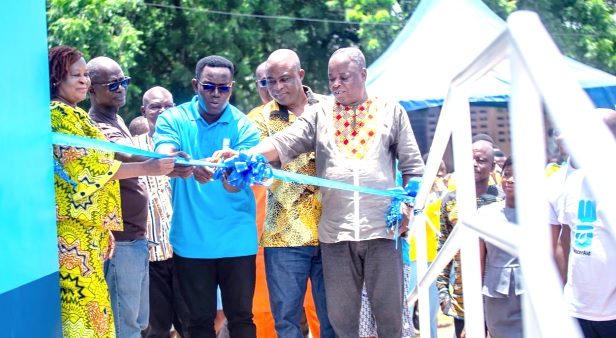 Sampson Tettey (middle), Head of Sustainable Services Programme, WaterAid Ghana, being assisted by Ababu Afeilbeik (right), Headmaster of Bolgatanga SHS, and other guests to inaugurate the facility. INSET: The WASH facility Sampson Tettey (middle), Head of Sustainable Services Programme, WaterAid Ghana, being assisted by Ababu Afeilbeik (right), Headmaster of Bolgatanga SHS, and other guests to inaugurate the facility. INSET: The WASH facility