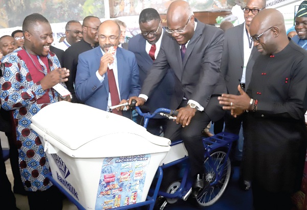 Kobina Tahir Hammond (on bike), Minister of Trade and Industry, at the exhibition. With him are Yeo Ziobeieton (right), Managing Director, Fan Milk Limited; Dr Humphrey Ayim-Darke (3rd from left), President, Association of Ghana Industries, and Irchad Razaaly (2nd from left), EU Ambassador to Ghana. Picture: SAMUEL TEI ADANO Kobina Tahir Hammond (on bike), Minister of Trade and Industry, at the exhibition. With him are Yeo Ziobeieton (right), Managing Director, Fan Milk Limited; Dr Humphrey Ayim-Darke (3rd from left), President, Association of Ghana Industries, and Irchad Razaaly (2nd from left), EU Ambassador to Ghana. Picture: SAMUEL TEI ADANO