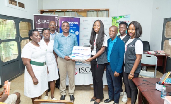Dr Mary Ansong, Executive Director of International Sickle Cell Centre, presenting the drugs to Peter Adjetey, Student Health Coordinator of Achimota School Dr Mary Ansong, Executive Director of International Sickle Cell Centre, presenting the drugs to Peter Adjetey, Student Health Coordinator of Achimota School