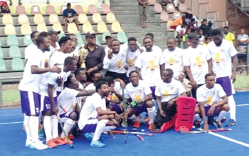 • Team Exchequers pose with the trophy after emerging 2025 Sapholda Greater Accra Hockey Gala champions last Saturday