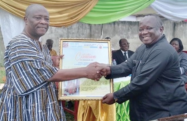 Prof. George Oduro (left) recieving a citation for his initiative and support for the library Prof. George Oduro (left) recieving a citation for his initiative and support for the library